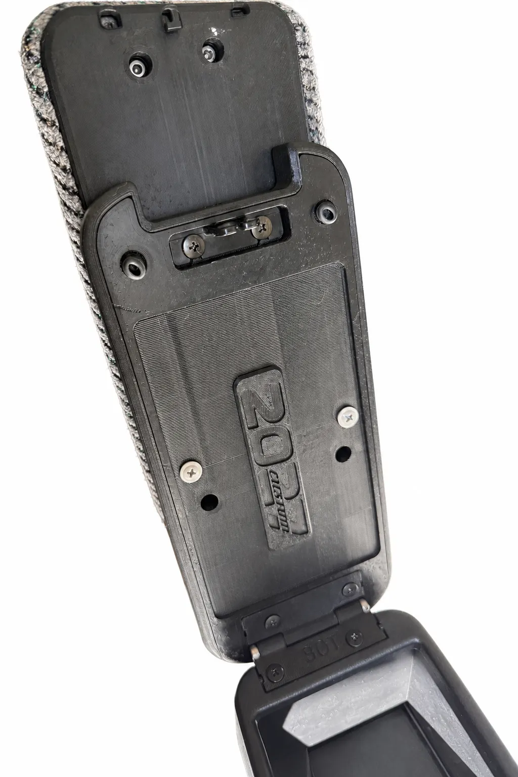 Armrest lid open, hinge and 2027 badge
